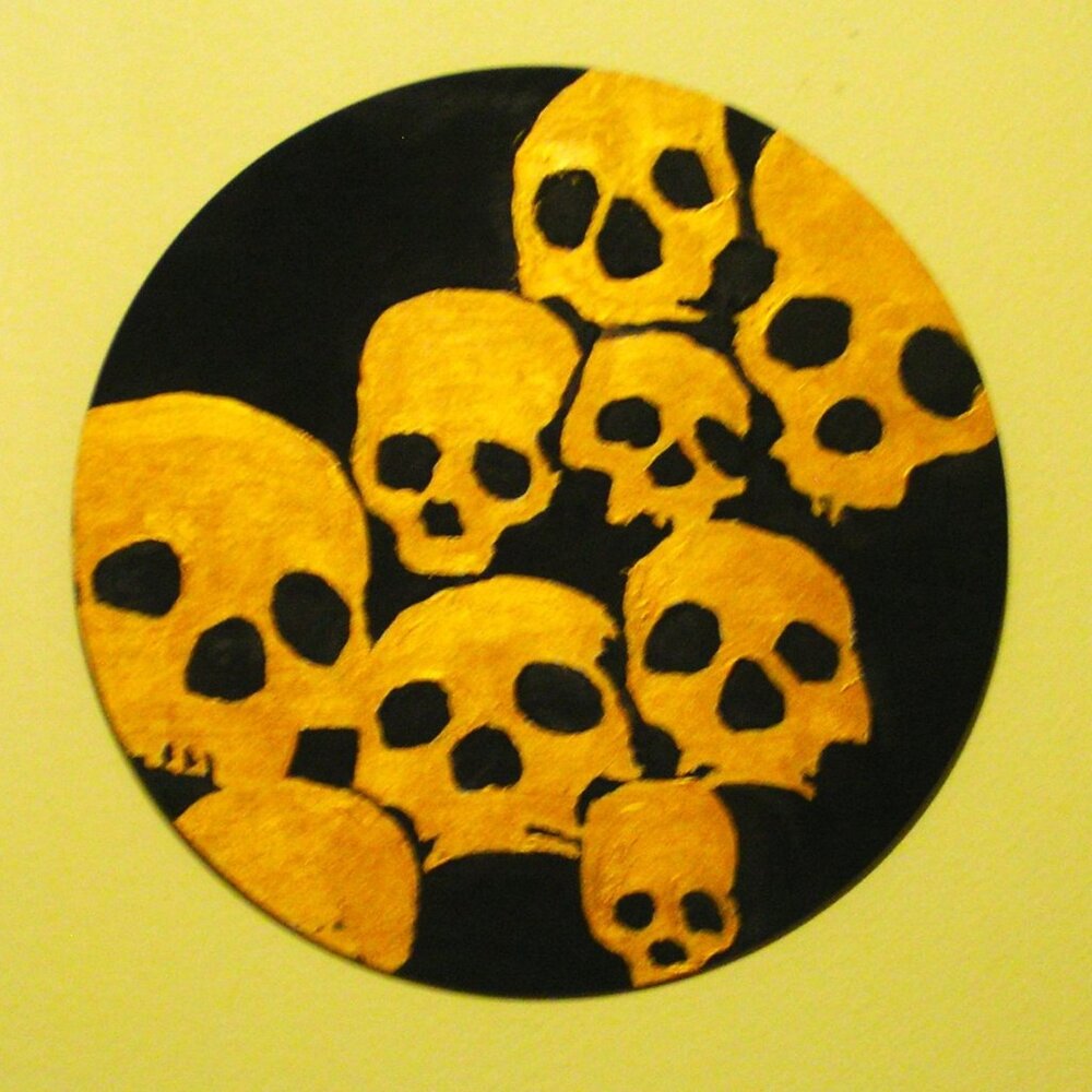 GOLD AND BLACK SKULLS ON 10" ROUND WOOD